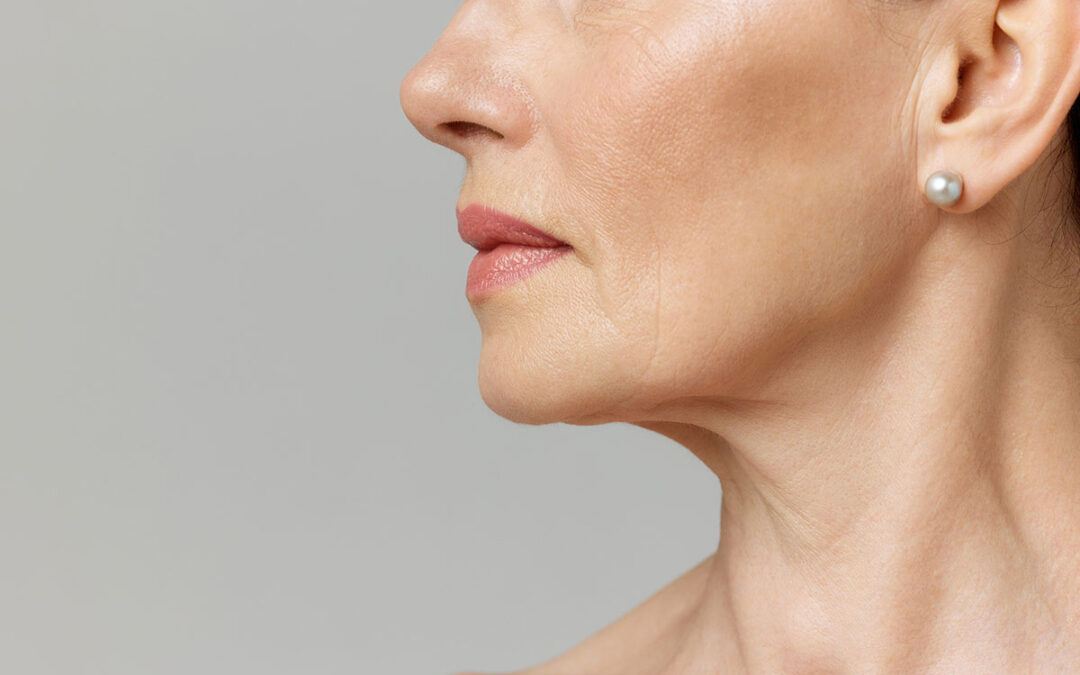 Cropped profile portrait with lips and chin neckline of middle-aged woman