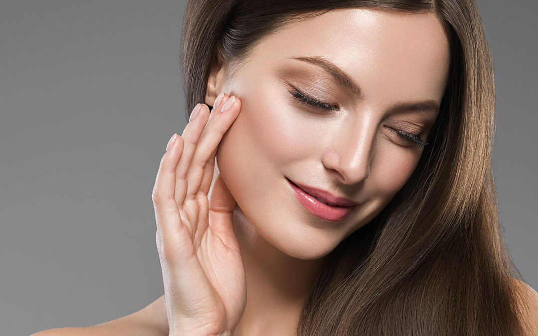 Beautiful female face healthy natural skin fashion make up brunette