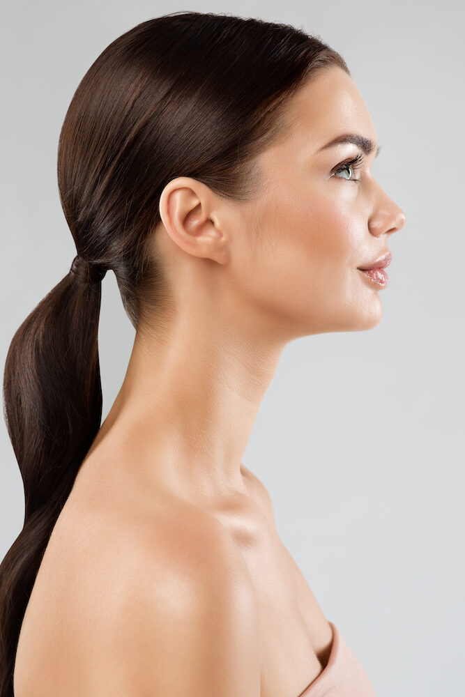 two beautiful woman with their heads on one another